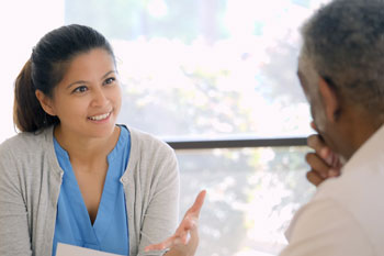 SNF health care worker interviews a patient.