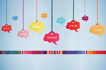 10 multicolored signs hanging by multicolored strings, each with the word 